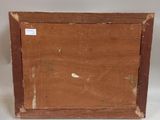 an old wooden box with a label on it sitting on a white surface