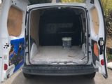 a white van with its doors open on the street
