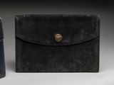 two black leather cases with a gold clasp on them