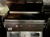 a picture of a grill with two burners on it
