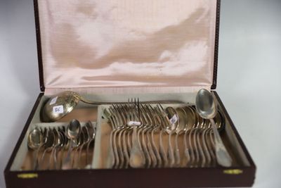 a box with silverware inside of it on a table