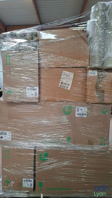 a lot of boxes stacked on top of each other in a warehouse