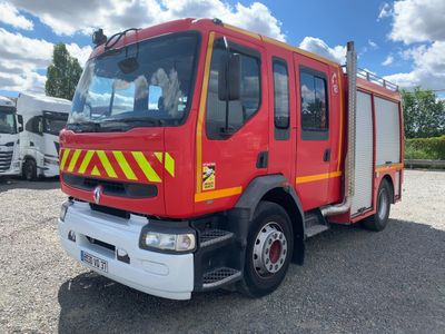 a red fire truck that is parked in a lot