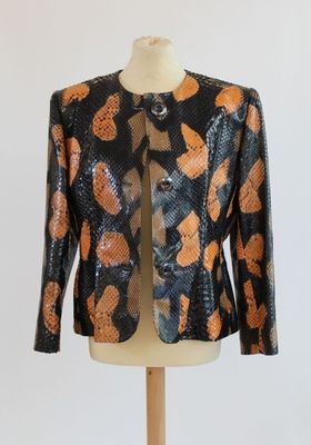 an orange and black jacket on a mannequin mannequin mannequin mannequin mannequin mannequin mannequin mannequin mann