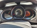 a close up of a car dashboard with various gauges