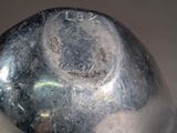 a close up of a metal object with a hole in it