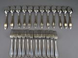 a set of eight silverplated flatware forks and spoons