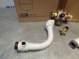 pipes and fittings on a table with a box in the background