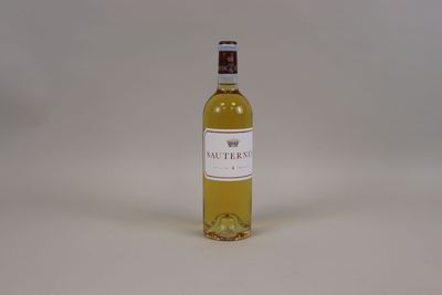 a bottle of wine that is sitting on a table