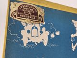 a blue and white book with a picture of people on it