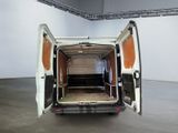 a white van with its doors open in a room