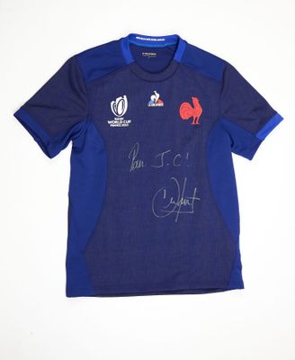 a close up of a blue shirt with a red rooster on it