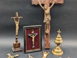 a cross, a crucifix, and other religious items on a table