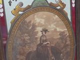 a picture of a man riding a horse in a stained glass window