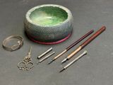 a bowl, scissors, and other items that are on the table