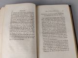 an open book that is sitting on a table