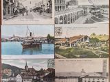 many pictures of old postcards on the table