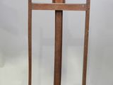 an image of a wooden easel with a piece of wood sticking out of it