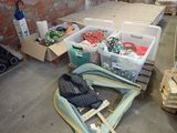 many boxes of clothes and other items on the floor