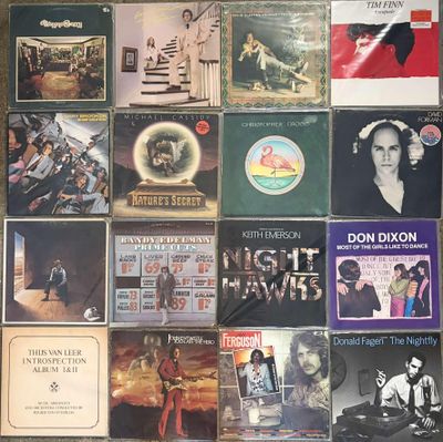 a lot of records on the wall of a room