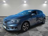 a blue car is parked on a checkered floor in a garage