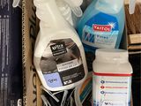 a box full of cleaning products on the floor