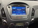 the dashboard of a car with a blue screen and a radio