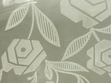 a glass plate with a pattern of flowers on it