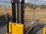 a forklift that is sitting next to a pallet
