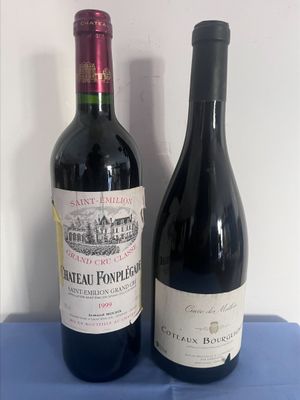 two bottles of wine sitting next to each other on a table