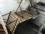 several pieces of wood are stacked on top of each other in a kitchen