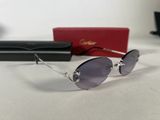 chanel sunglasses with purple lenses and case on a white surface