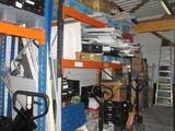 a garage with a lot of boxes and tools on the shelves