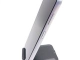 a close up of a cell phone on a stand