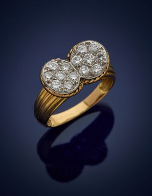 a gold and diamond ring, by business