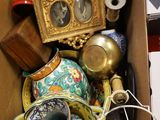 a cardboard box filled with assorted items on the floor