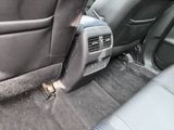 a picture of the inside of a car with the door open