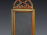 an old wooden frame with a mirror in the middle of it