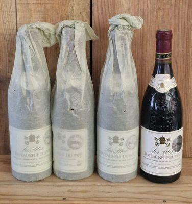 three bottles of wine sitting on a shelf next to a bottle of wine