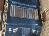 a box with a laptop inside of it on the floor