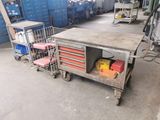 a workbench that has a lot of tools on it