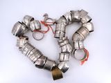 a heart made out of metal pipes on a white surface
