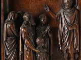 an image of a wooden relief of a group of people