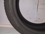 a close up of a tire on a shelf in a room