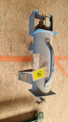 a picture of a blue machine with a yellow tag on it