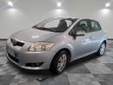 a picture of a silver toyota yaris parked in a garage
