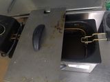 a hot dog sitting inside of an oven in a kitchen
