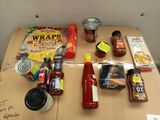 a table with a variety of condiments and condiments on it