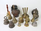 many different types of bells on a white surface