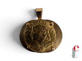 an image of a gold coin with a woman ' s face on it
